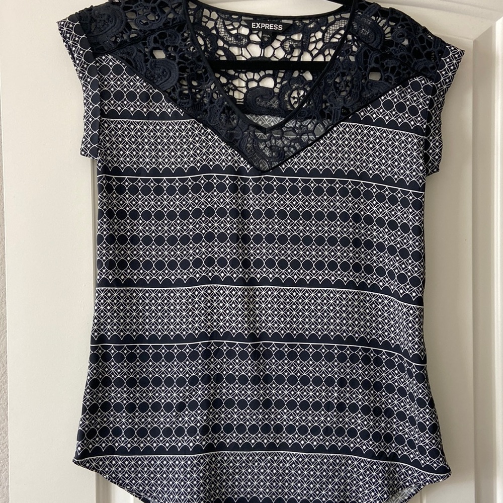 Navy and white dress shirt with crochet detail around neck